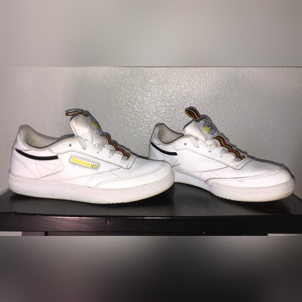 White with red black and yellow lining, size 3, Reebok tennis shoes